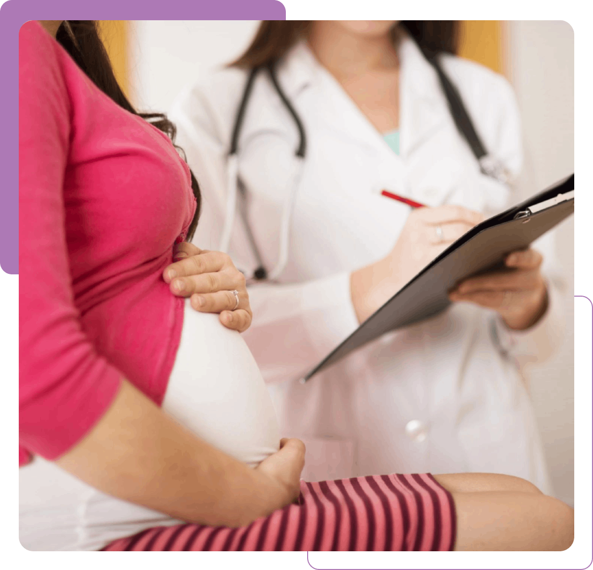 Pregnant woman consulting doctor with clipboard