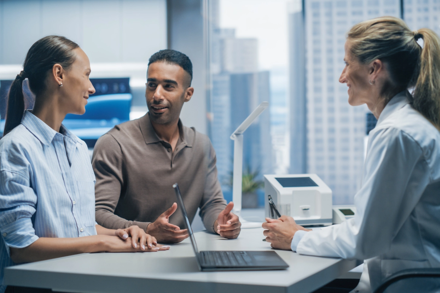 Couple consulting doctor in medical office