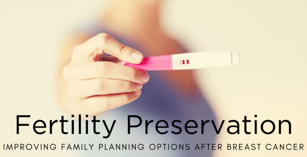 Hand holding positive pregnancy test stick