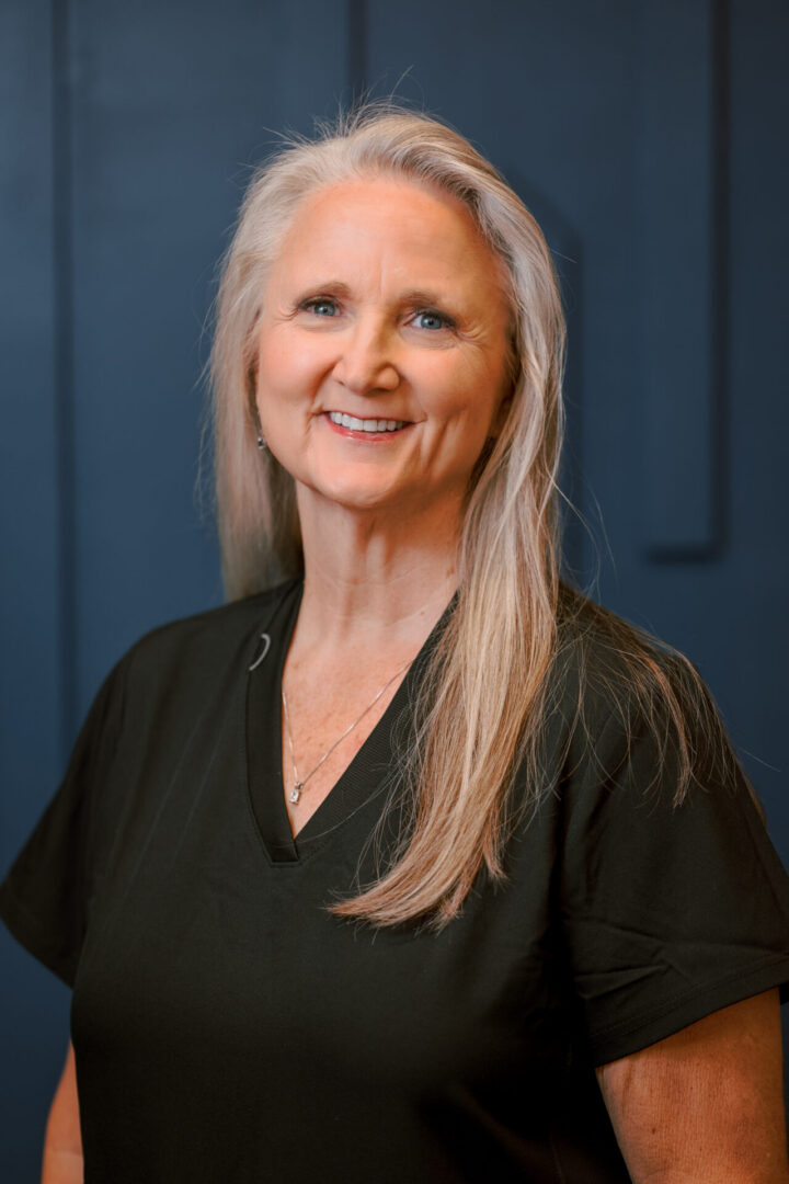 Woman in black shirt smiling