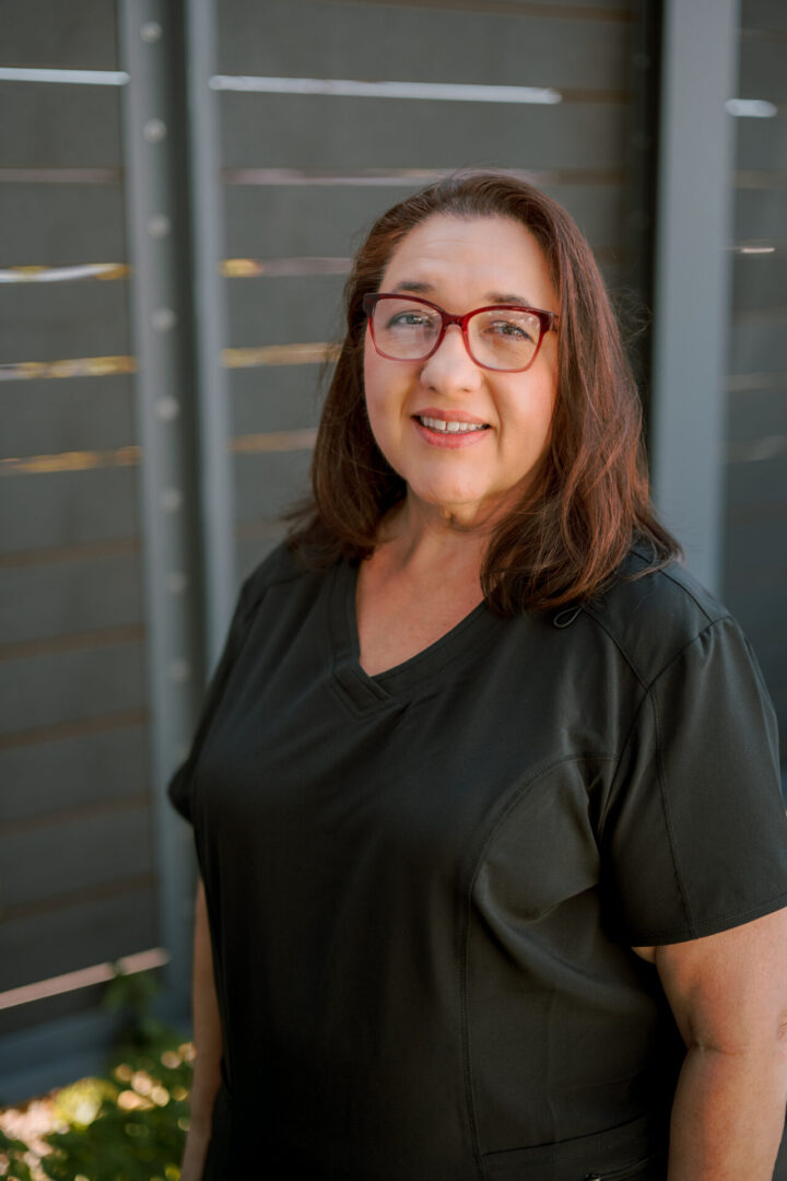 Person in black shirt smiling