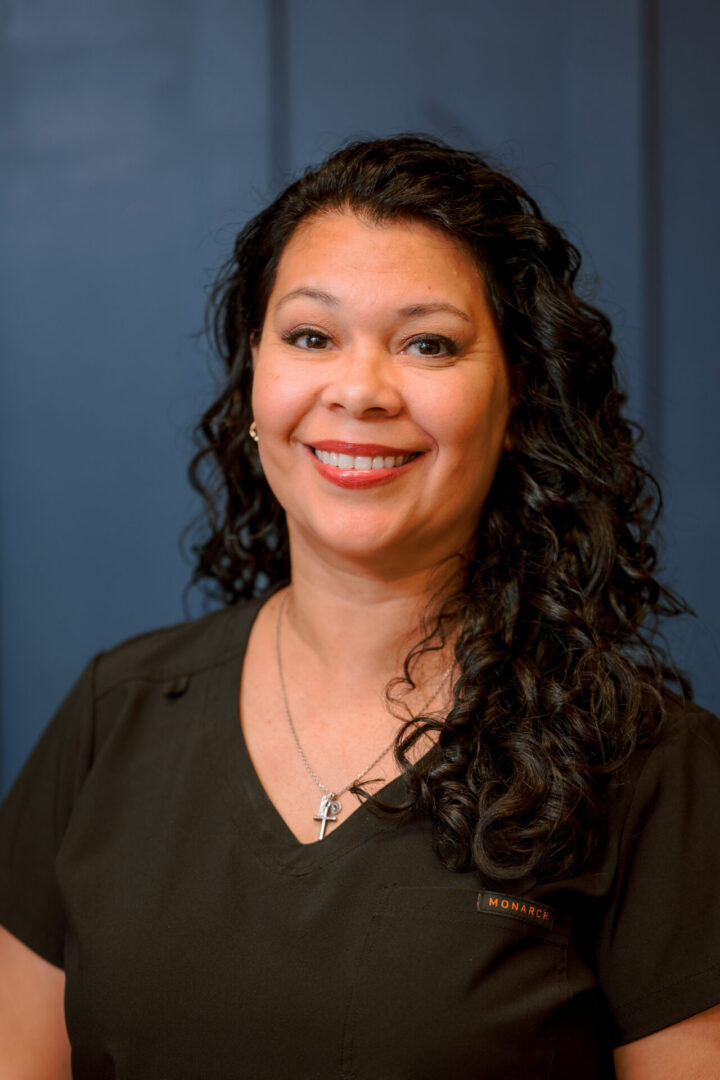 Smiling woman with curly hair