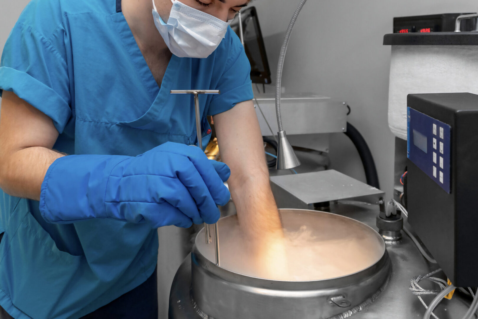 Scientist managing frozen materials