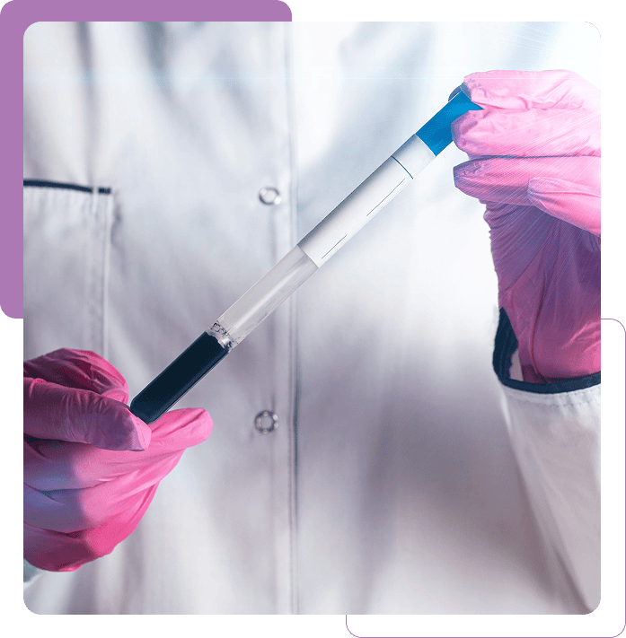 Scientist holding a syringe with gloves