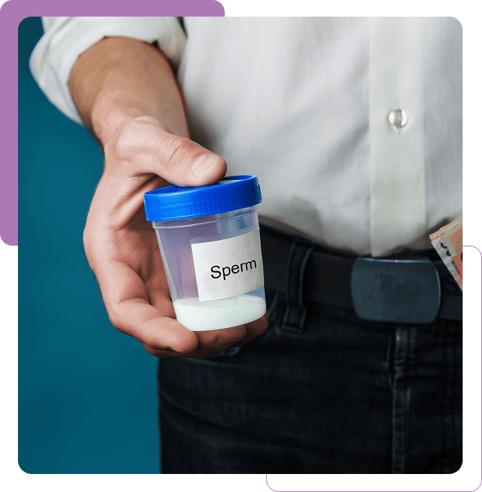 Person holding a sperm sample container
