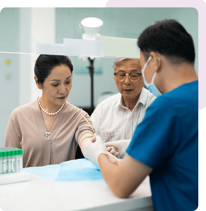 Nurse drawing blood from patient